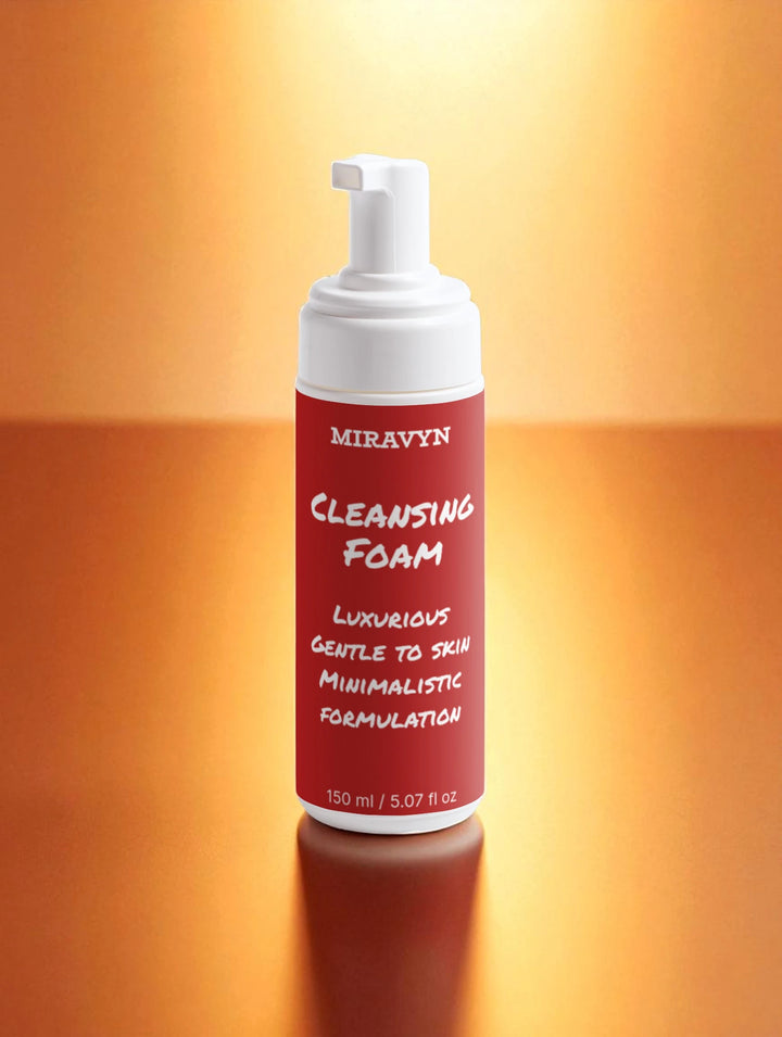 Miravyn cleansing foam bottle on a gradient orange background.