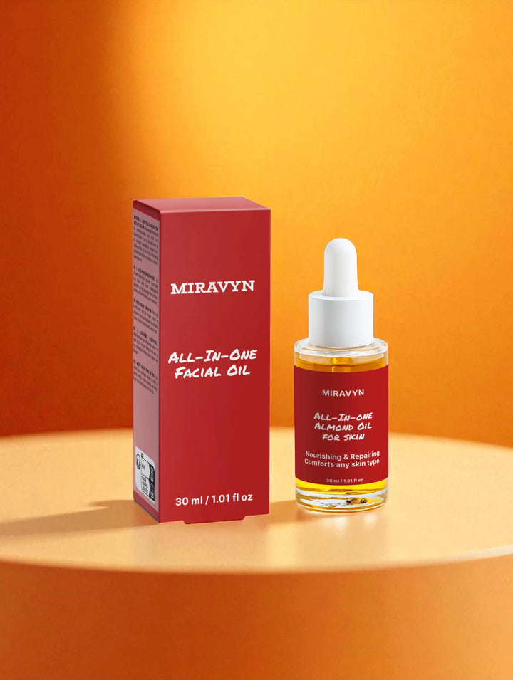 Miravyn Almond oil for skin with packaging on an orange background.