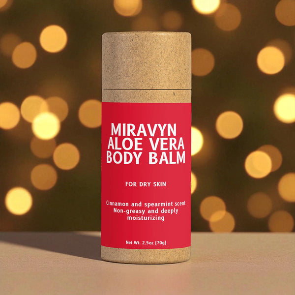 Miravyn Aloe Vera Balm container with a red label against a blurred warm light background.