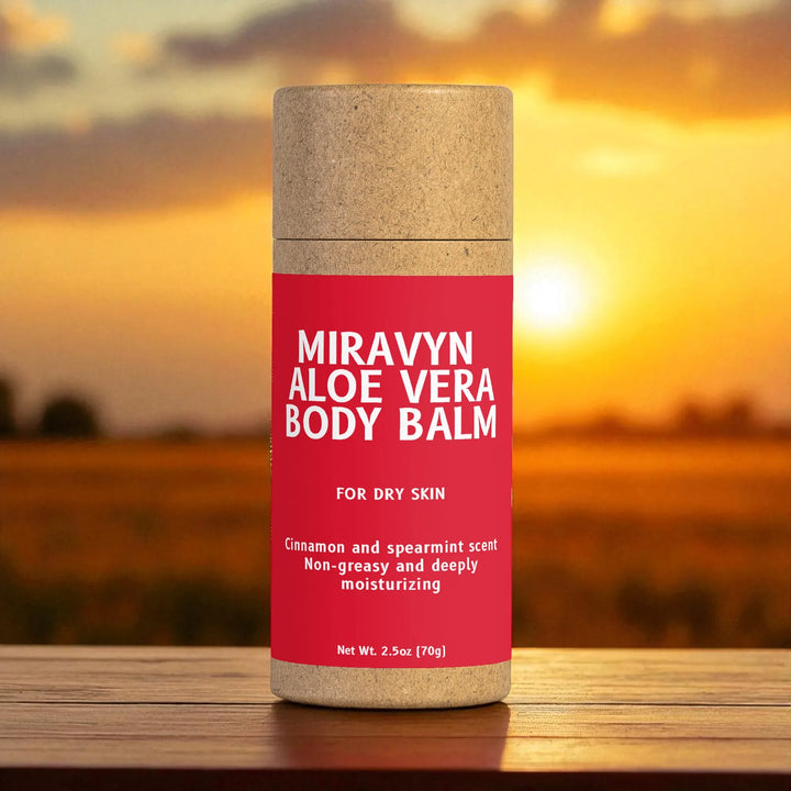 Miravyn Aloe Vera Body Balm container with a sunset background.