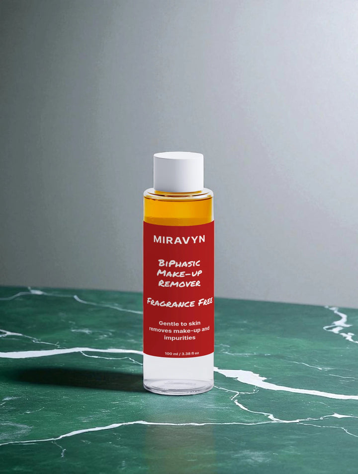 Miravyn aloe vera facial cleanser bottle on a green marble surface with a gray background.