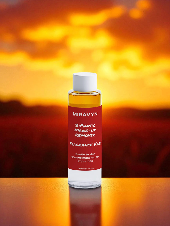 Miravyn aloe vera facial cleanser & Bi-Phasic Make-Up Remover bottle with a sunset background.