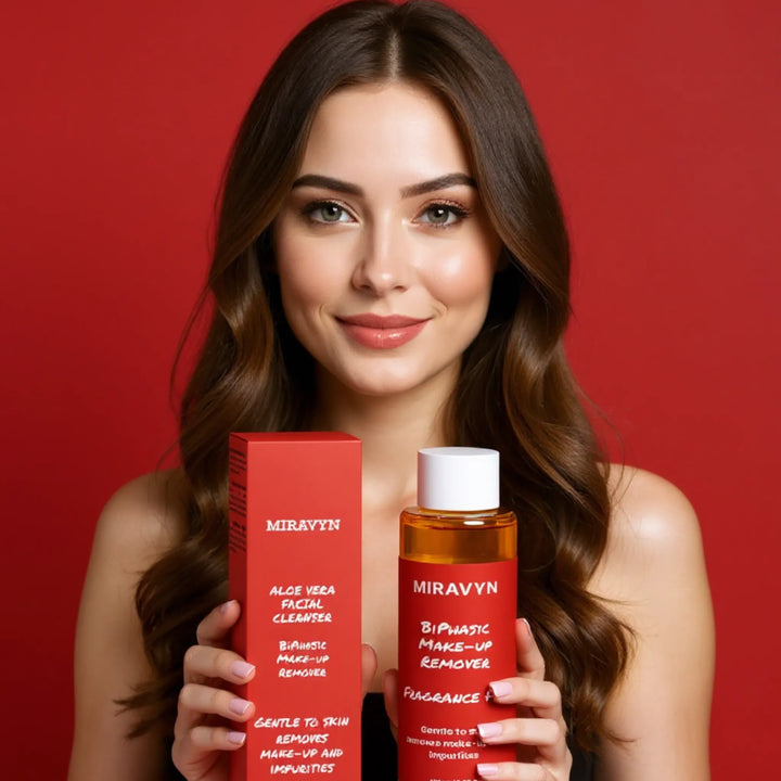 Woman holding Miravyn aloe vera facial cleanser product against a red background.