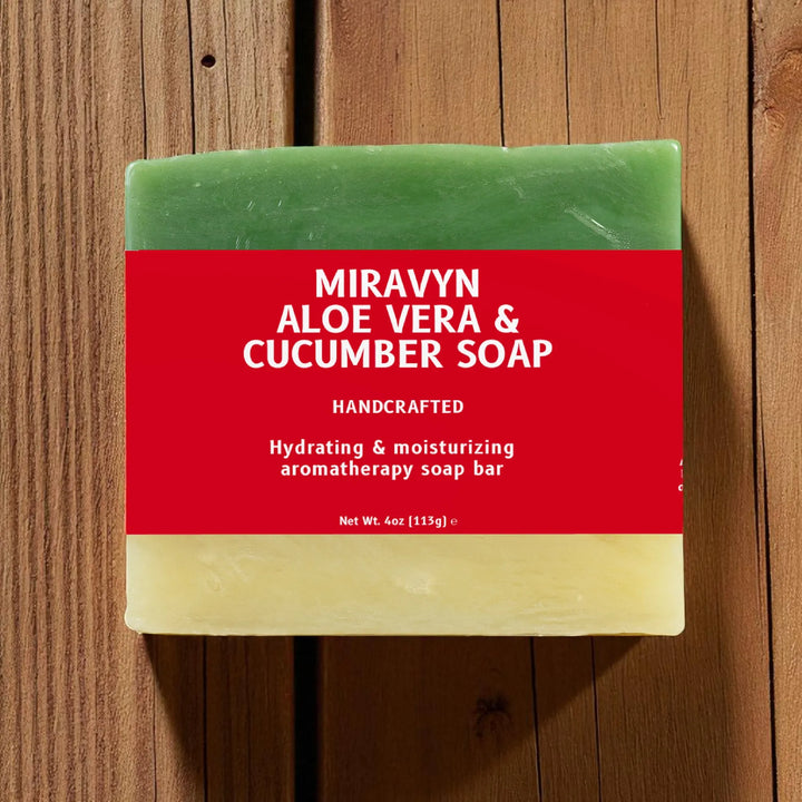 Bar of Miravyn Aloe Vera & Cucumber Soap on a wooden surface.