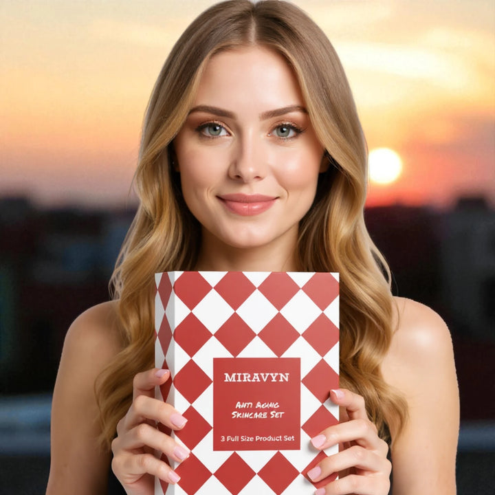 Woman holding a Miravyn anti-aging skincare set with a sunset background.