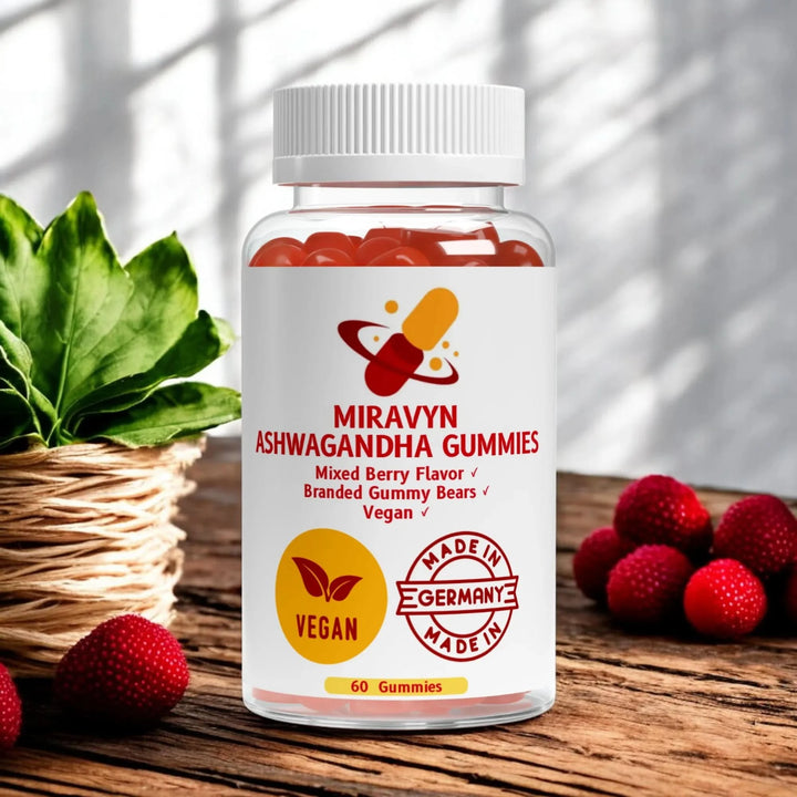 Bottle of Ashwagandha Gummies branded gummy bears with berries and a plant on a wooden surface.