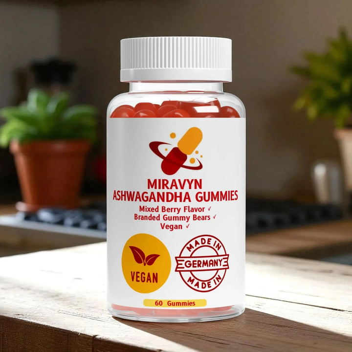 Miravyn Ashwagandha Gummies branded gummy bears on a wooden surface with a blurred background.