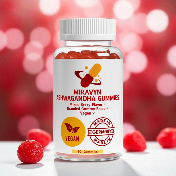 Bottle of Ashwagandha Gummies branded gummy bears with a blurred red and pink background.