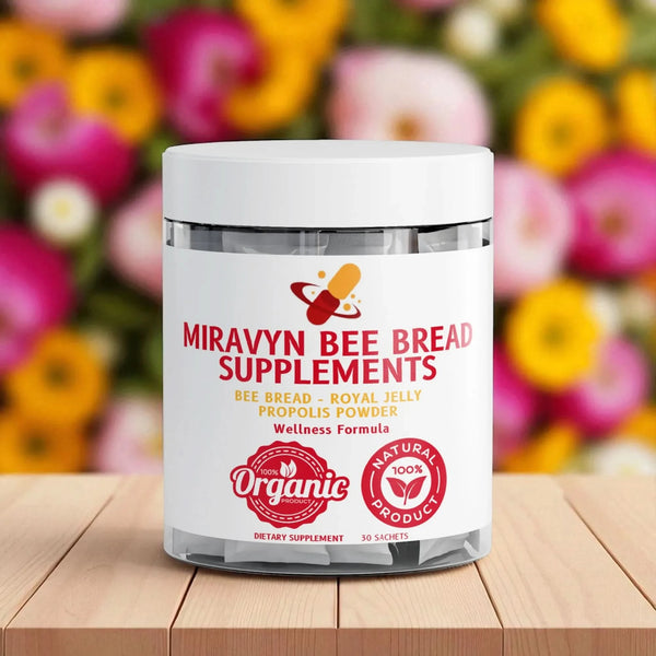 Jar of Miravyn Bee Bread Supplements on a wooden surface with flowers in the background.