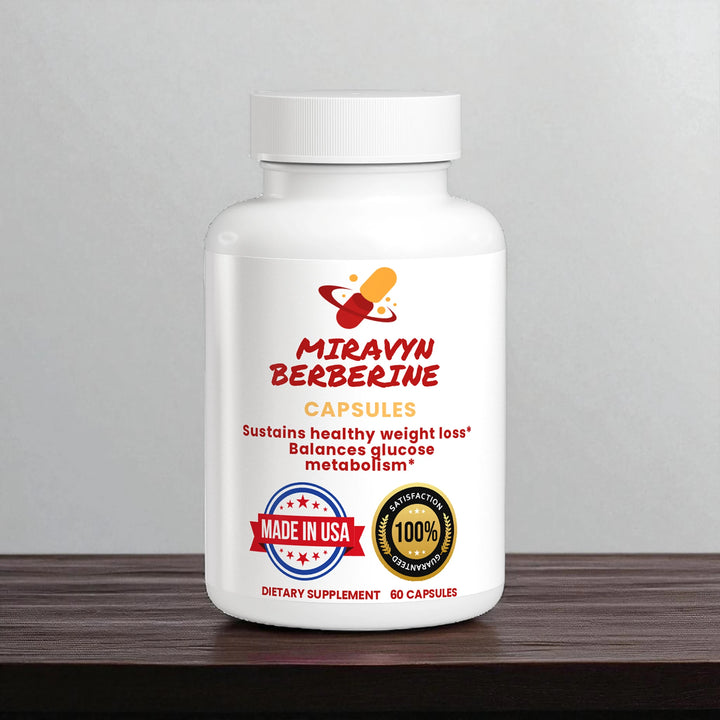White supplement bottle labeled 'Miravyn Berberine' on a wooden surface with a gray background.