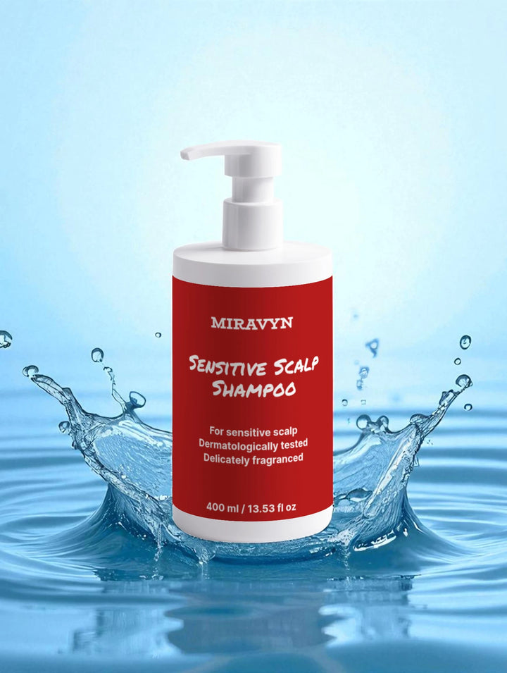 Miravyn sensitive scalp shampoo bottle with red label and white pump in water.