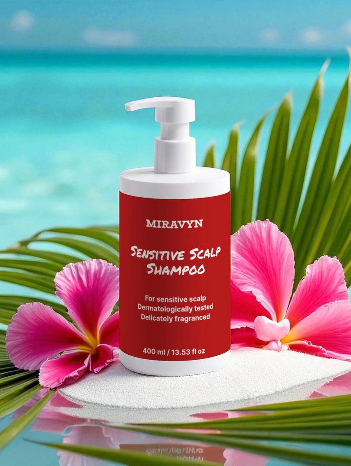 Miravyn sensitive scalp shampoo bottle with tropical flowers and ocean background.