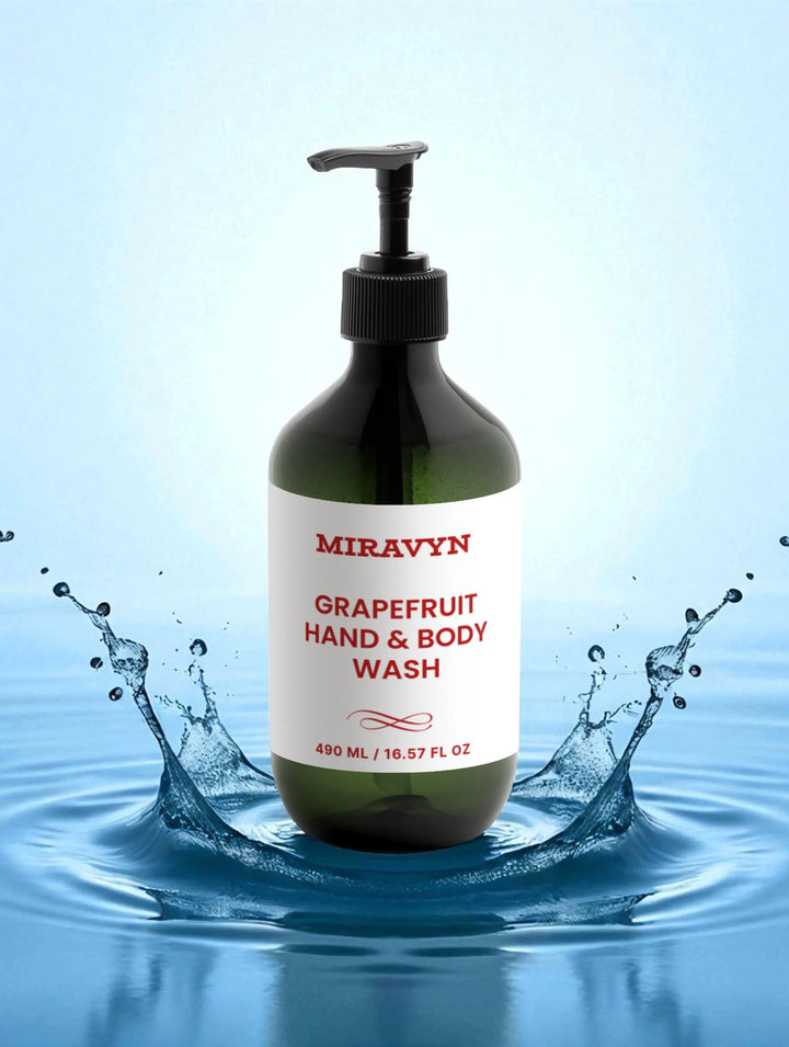 Miravyn Grapefruit Hand & Body Wash bottle with water splash on a blue background.