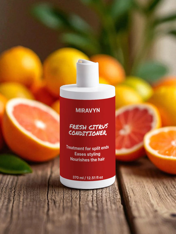 Miravyn Fresh Citrus Conditioner bottle with oranges in the background.