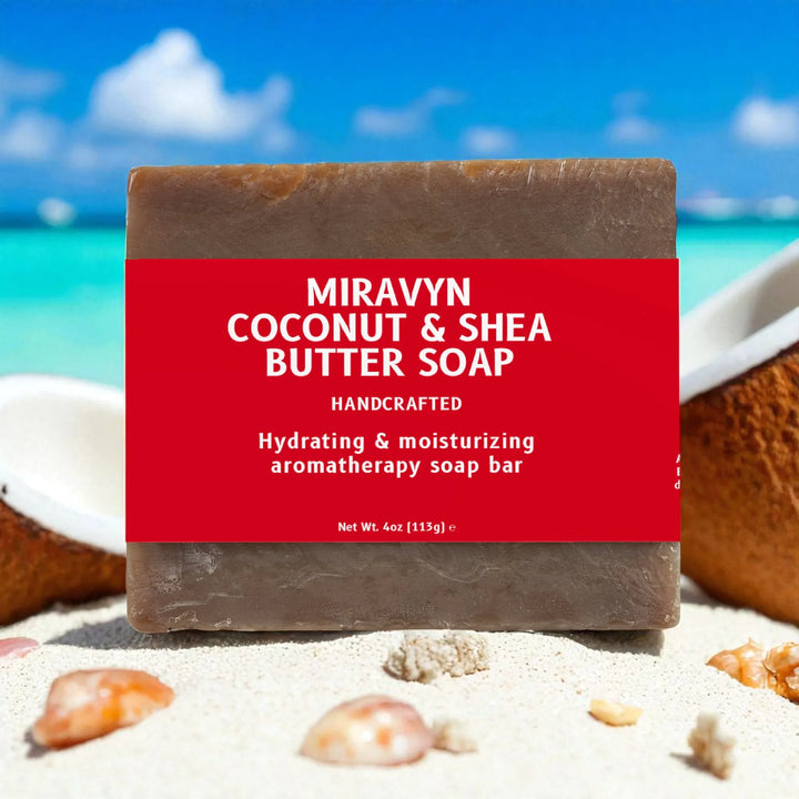Miravyn Coconut & Shea Butter Soap with a red label on a beach background.