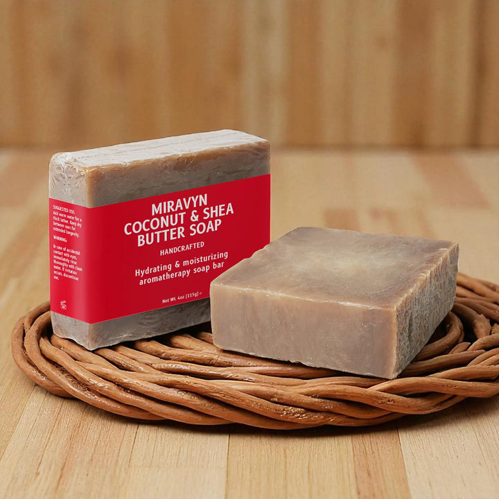Miravyn Coconut & Shea Butter Soap on a woven mat with a wooden background.