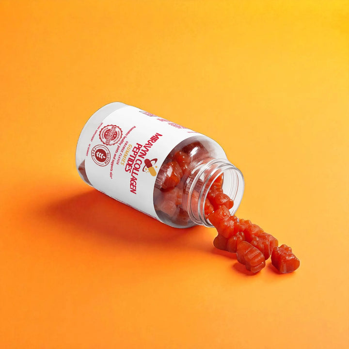 Opened bottle of collagen gummies with a label on an orange background.