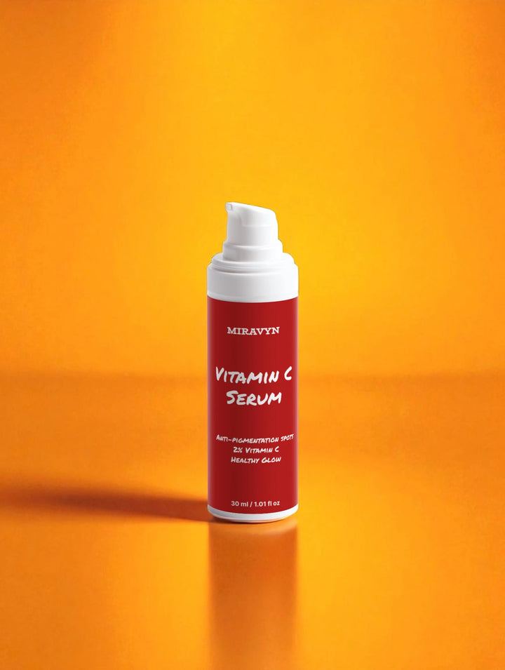 Miravyn's dark spot correcting glow serum on an orange background.