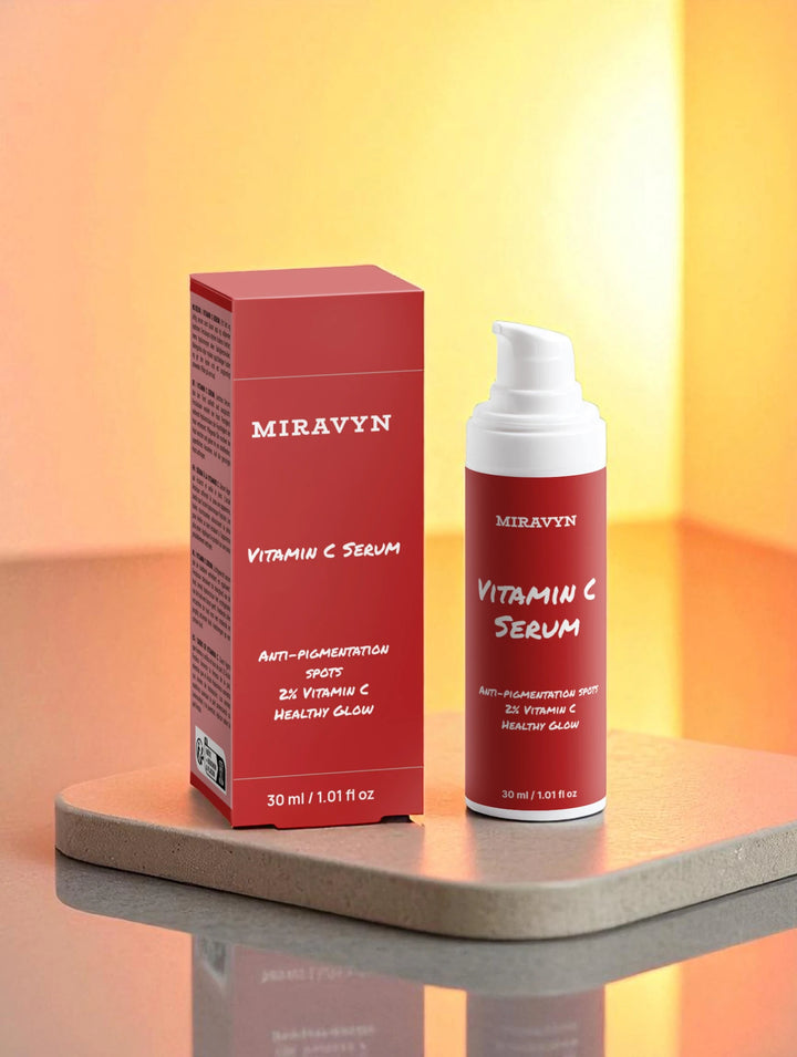 Miravyn dark spot correcting glow serum duo on a marble piece and golden light.