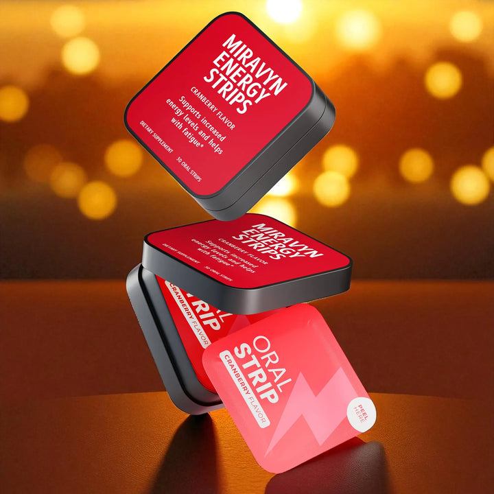 Red and black Miravyn Energy Strips with cranberry flavor packaging under bokeh effect.