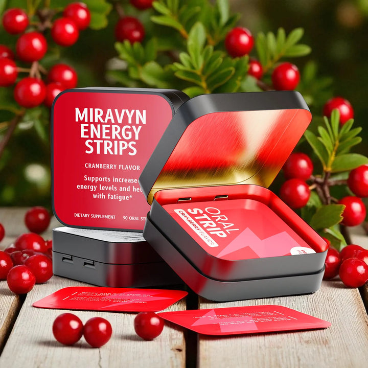 Opened Miravyn Energy Strips with cranberry flavor on a wooden surface.