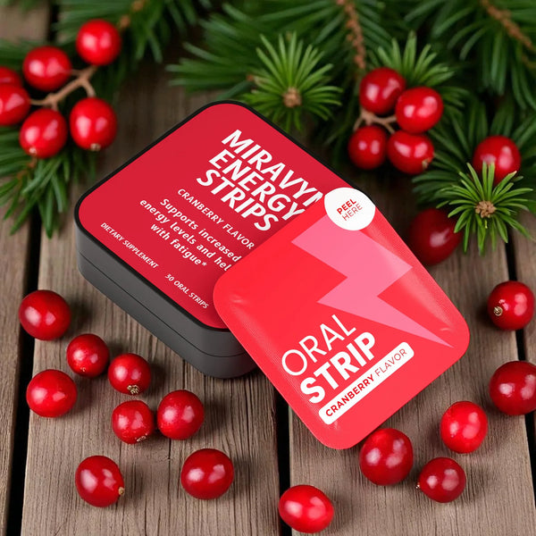 Energy Strips with cranberry flavor packaging with cranberries on a wooden surface.