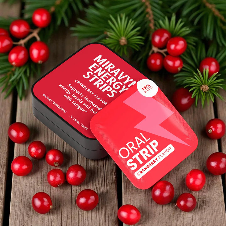 Energy Strips with cranberry flavor packaging with cranberries on a wooden surface.