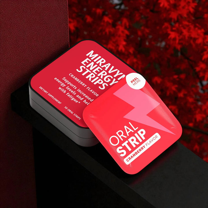 Red packaging of Miravyn Energy Strips next to a beautiful autumn view.