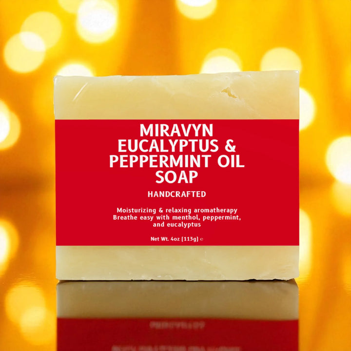 Bar of eucalyptus soap with a red label on a blurred yellow background.
