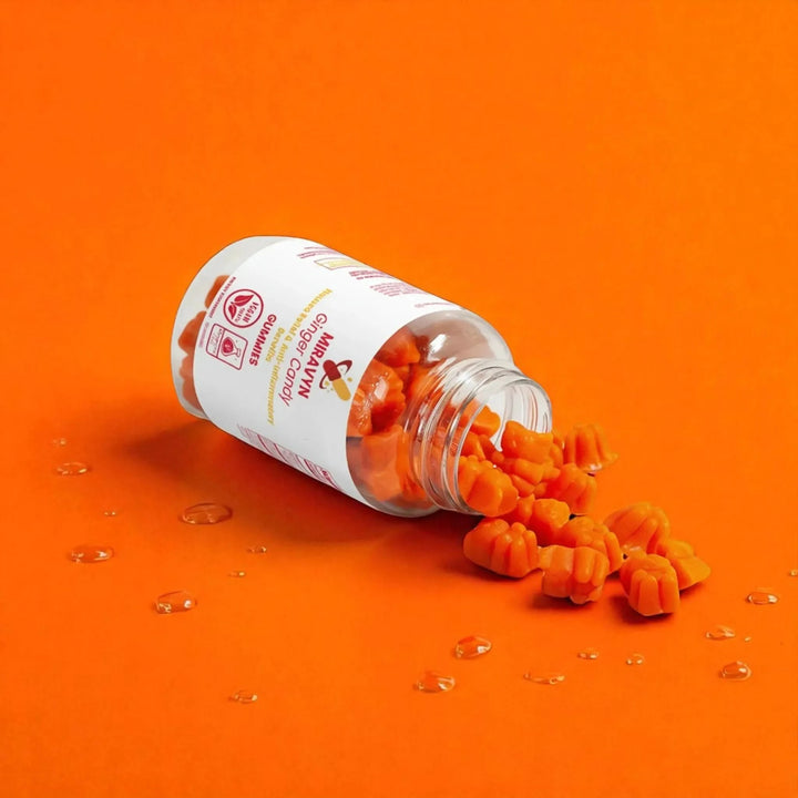 Ginger candy for nausea – ginger chews, essential for nausea relief and anti-inflammatory benefits, vegan, antibiotic-free, orange background.