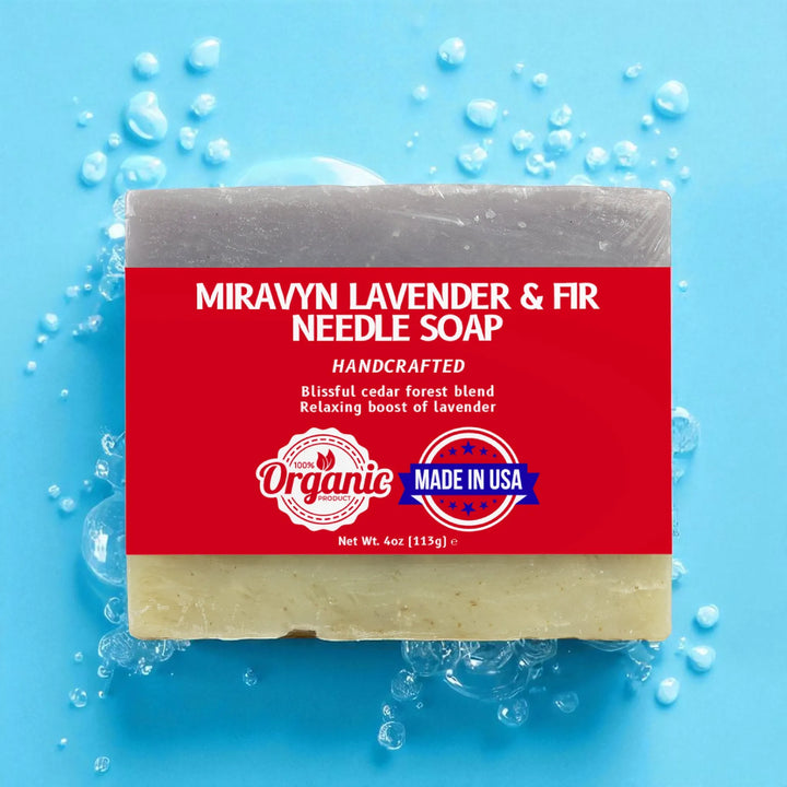 Bar of Miravyn Lavender & Fir Needle Soap with a red label on a blue background with soap bubbles.