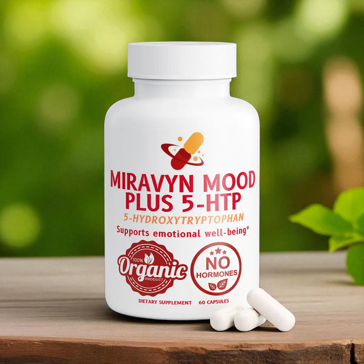 White bottle of Miravyn Mood Plus 5-HTP supplement with red text on a wooden surface with a green background.