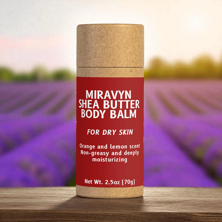 Miravyn Shea Butter Balm container with a lavender field in the background.