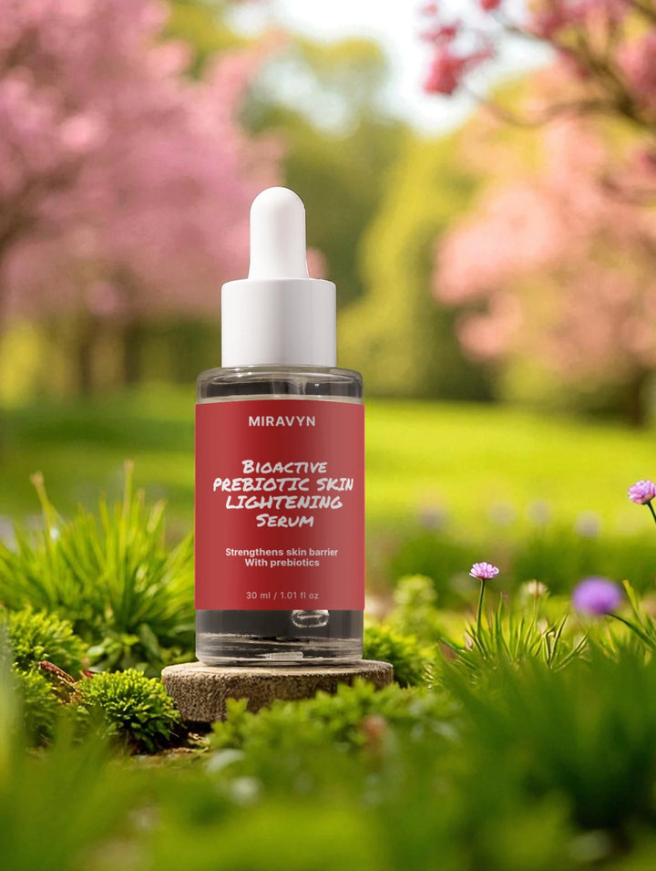 Miravyn skin lightening serum bottle with a garden background.
