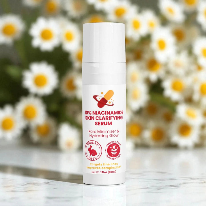 Skin lightening serum bottle with daisies in the background.