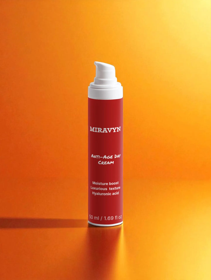 Cream tube from skincare routine set with white cap on an orange gradient background.