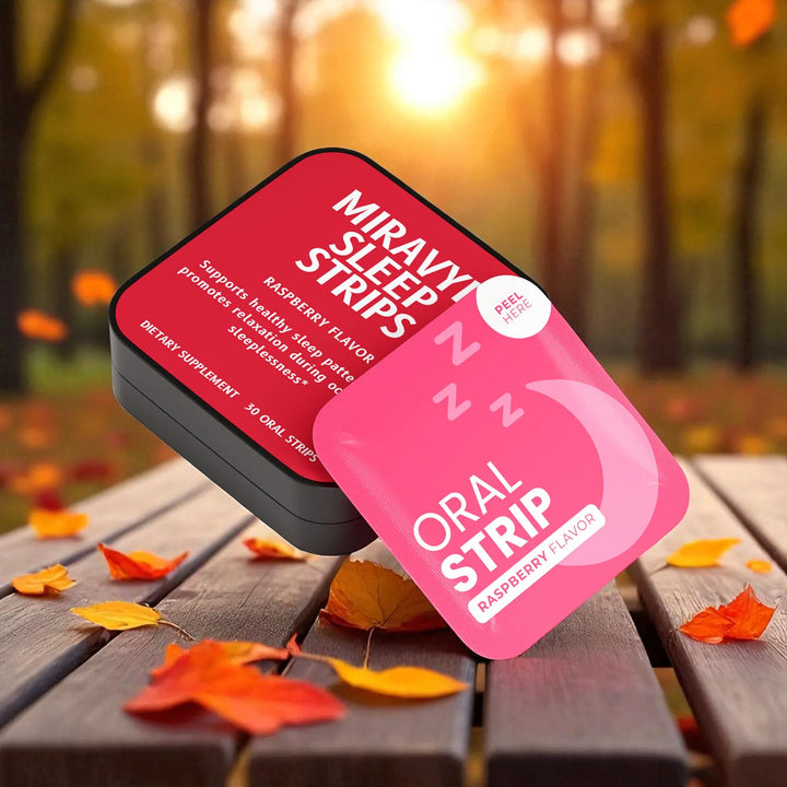Miravy Sleep Strips packaging on a wooden surface with autumn leaves and a blurred forest background.