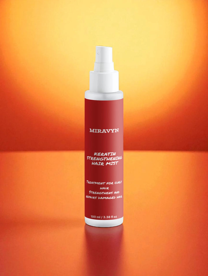 Miravyn strengthening hair mist on an orange background.