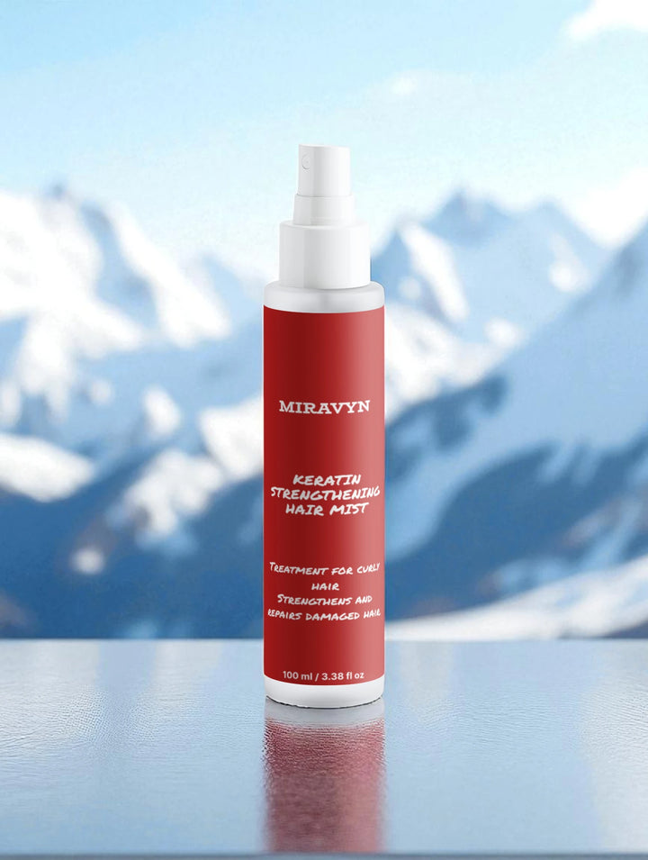 Miravyn strengthening hair mist on a reflective surface with blue and white abstract background.