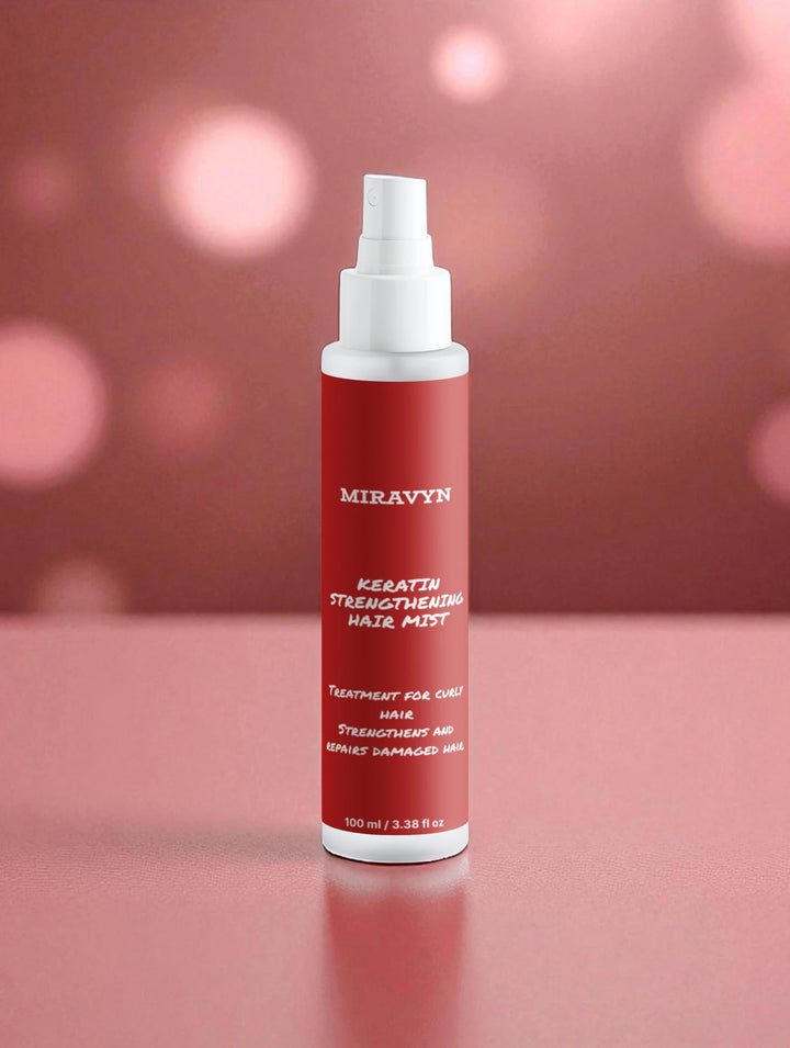Miravyn's Strengthening hair mist on a pink background.