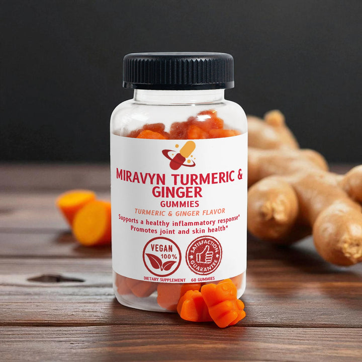 Bottle of Miravyn Turmeric & Ginger Gummies on a wooden surface with turmeric roots in the background.