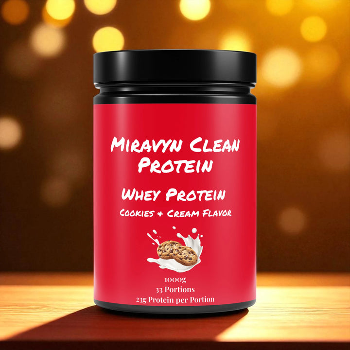 Red Miravyn whey protein powder  cookies & cream container on a wooden surface & warm background.