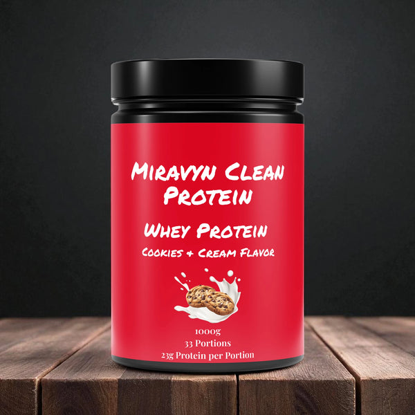 Miravyn whey protein powder cookies & cream with black lid on a wooden surface.