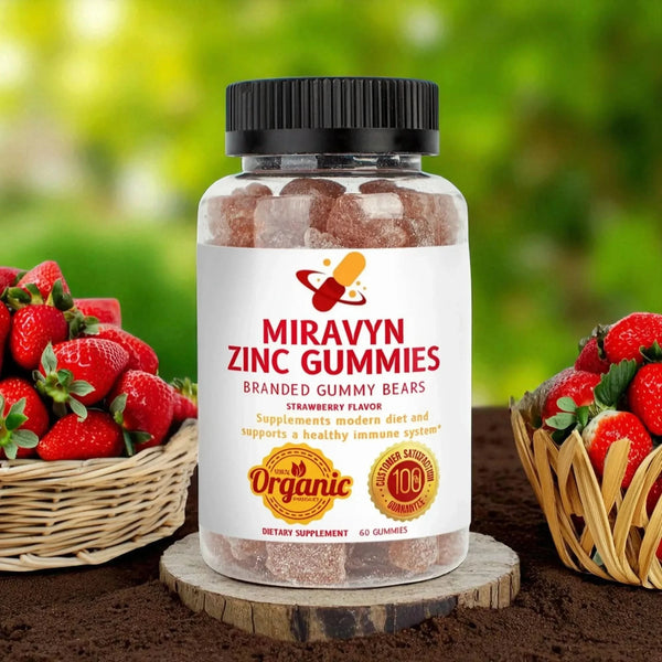 Miravyn's organic branded gummy bears , zinc gummies with plenty of strawberries, in a garden.